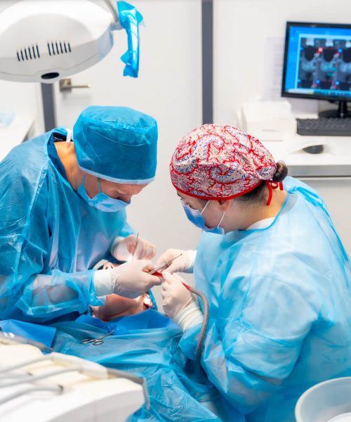 female-dentists-in-blue-scrubs-performing-a-compli-2022-09-29-20-19-17-utc